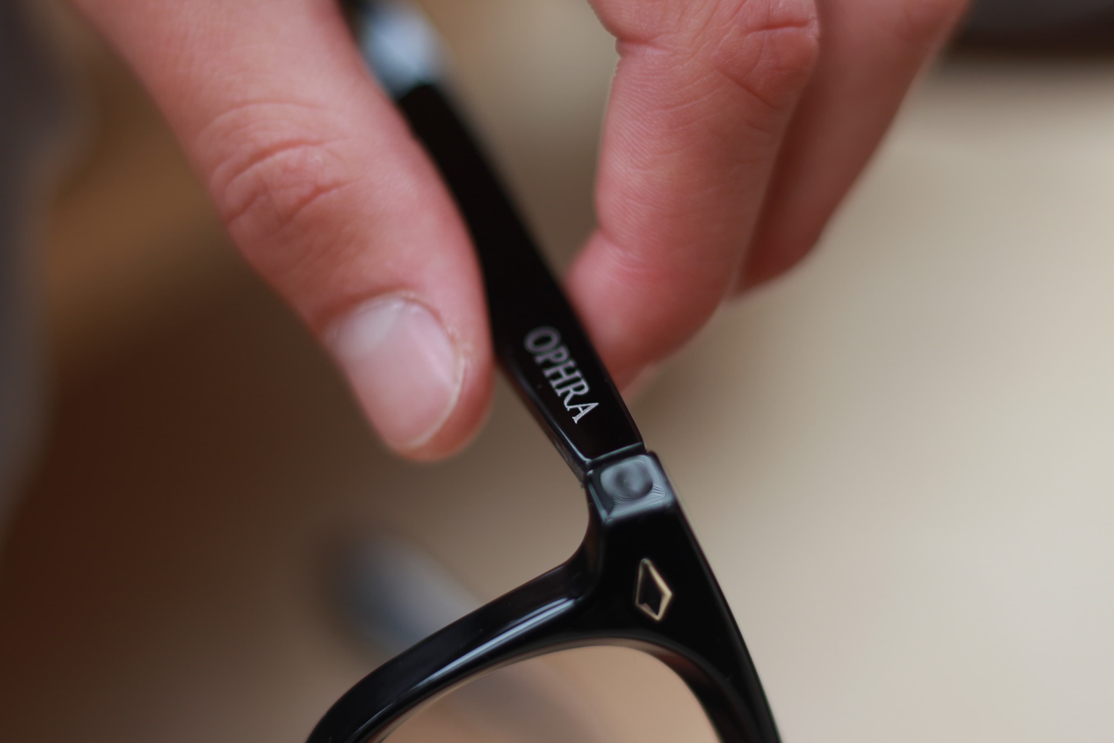 Close-up of the OPHRA engraving on a sunglasses temple