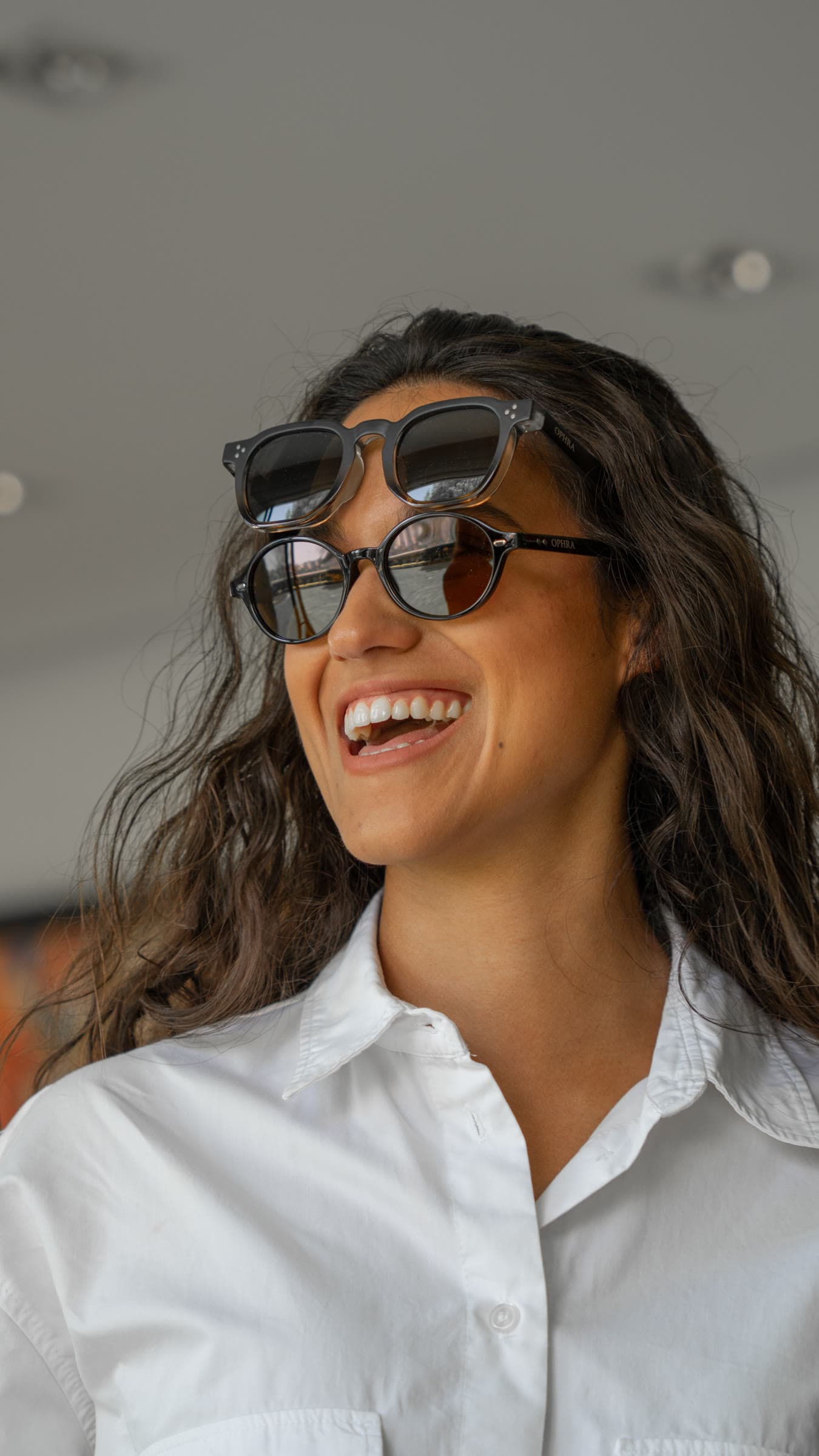 Model wearing OPHRA sunglasses in natural light, lookbook portrait