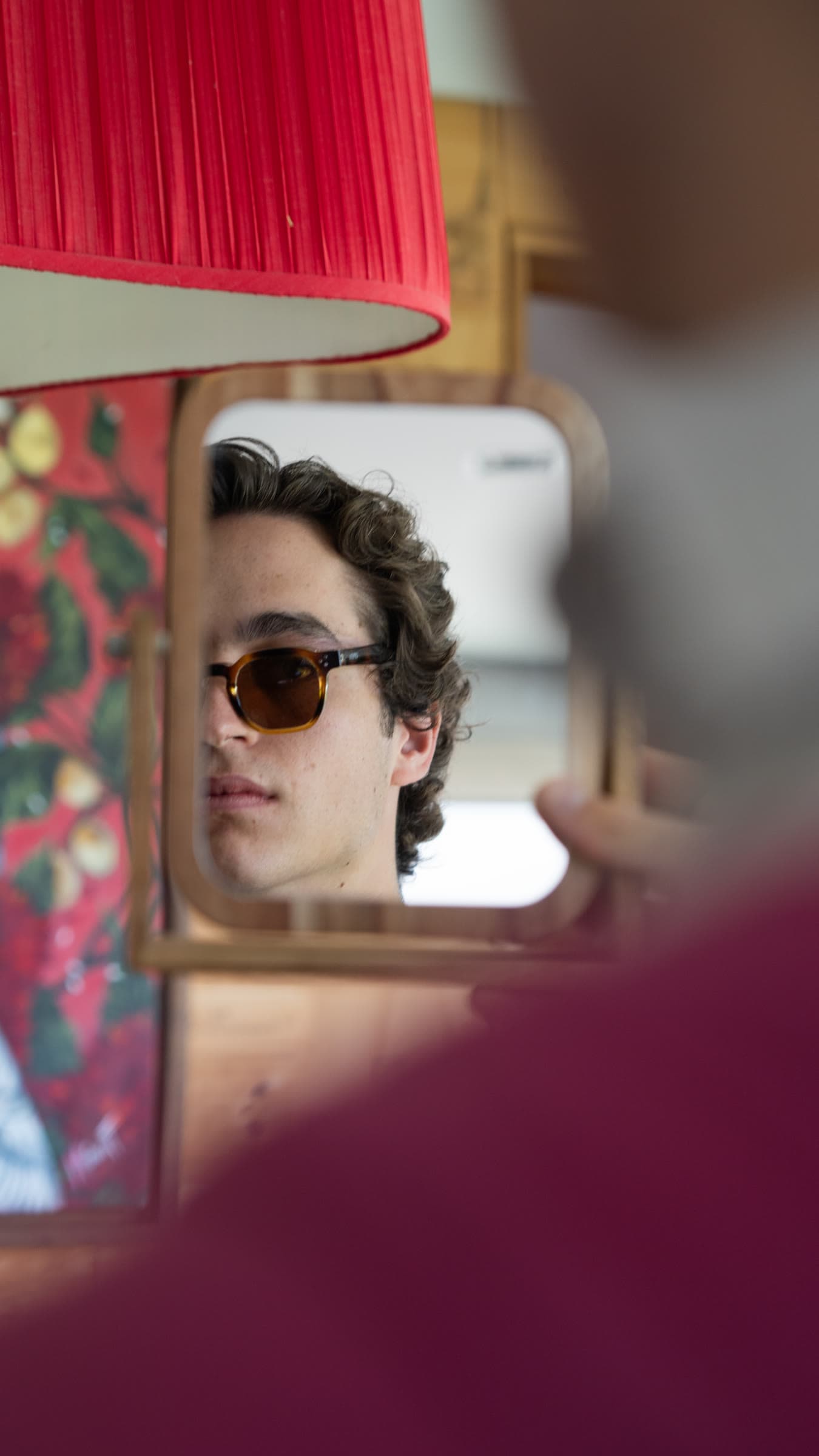 Model in OPHRA sunglasses, close-up lookbook portrait
